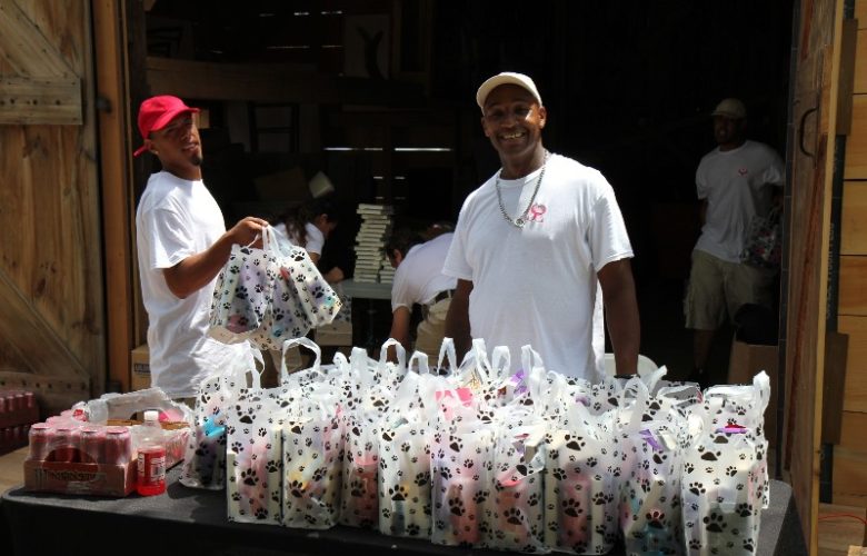 Handing out the goodie bags, Shecky's crewmembers, Josh and Lewis