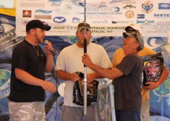 zach-miller-presenting-captain-richie-nessel-a-custom-barrett-rod-for-the-first-place-win