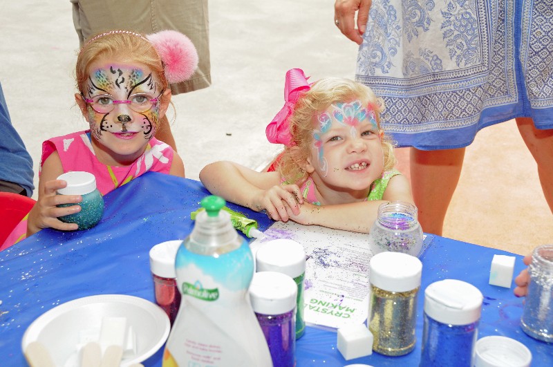 Grace and Catherine Villar made crystal balls at the 2014 CMEE Family Fair.