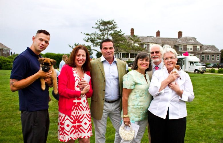 Southampton Animal Shelter lead trainer Matt Valentino, Joanne and Joe Giordano, Debbie and Skip Elliott and executive director Pat Gray, with two puppies who have yet to be named.