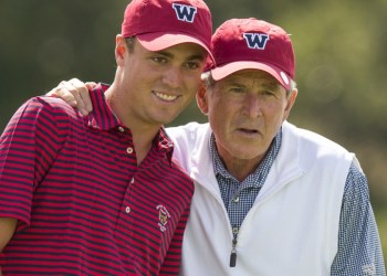 Former President George W. Bush lines up a putt with Justin Thomas during a practice round with the USA Walker Cup team at the 2013 Walker Cup at National Golf Links of America in Southampton on Thursday. ©USGA/John Mummert