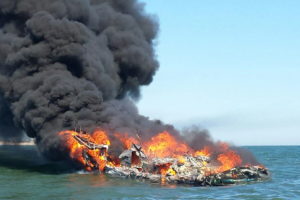 The Coast Guard rescued three people from the water after their boat caught fire near Shinnecock April 6.