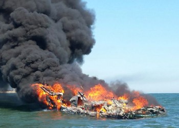 The Coast Guard rescued three people from the water after their boat caught fire near Shinnecock April 6.