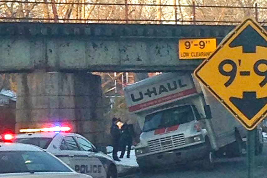 A U-Haul gets stuck under a bridge in East Hampton.