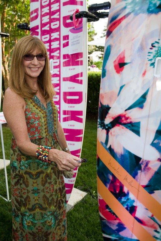 Nicole Miller with the paddleboard she designed.