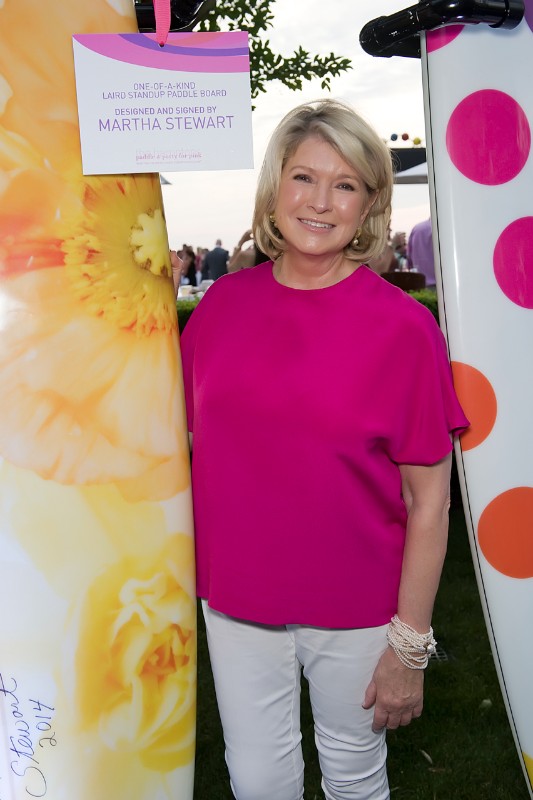 Martha Stewart with the be-flowered board she designed.