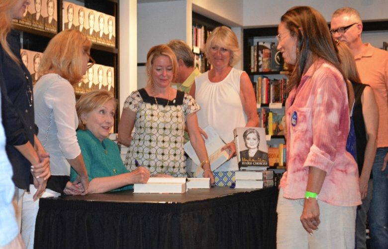 Hillary Clinton autographs "Hard Choices" for a fan.