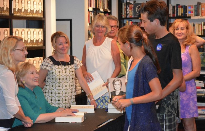 Hillary Clinton autographs "Hard Choices" for young fans.