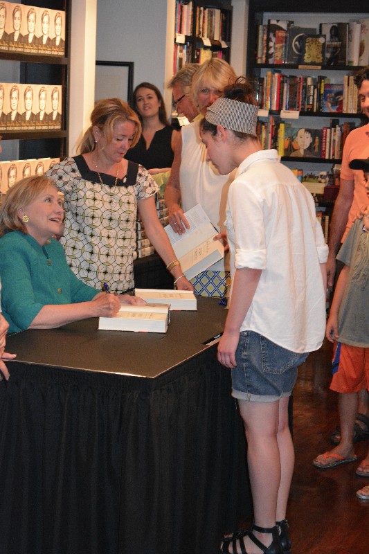 Hillary Clinton autographs "Hard Choices" for a fan.