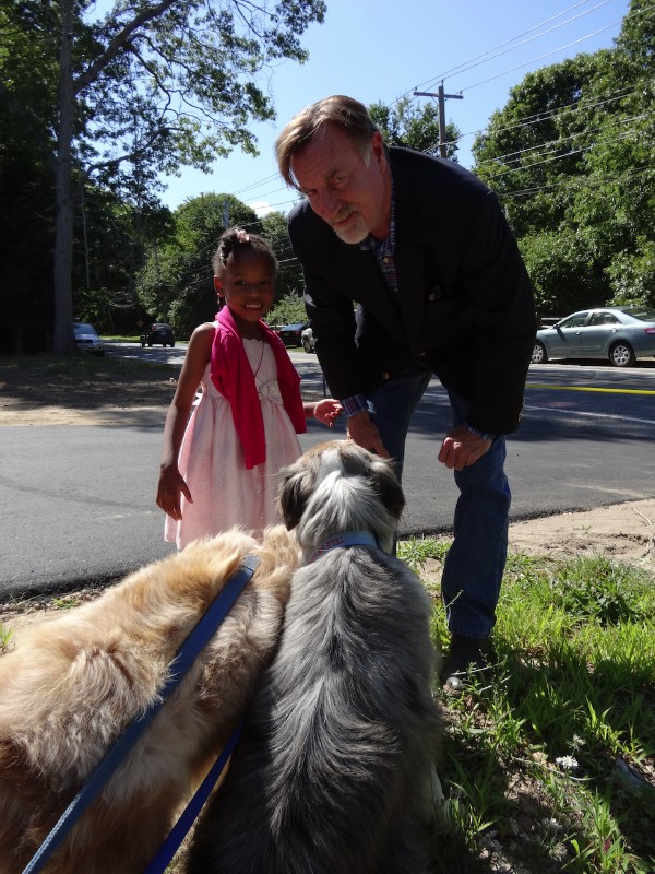 Saniyah Ashley with Habitat for Humanity Peconic President Mark Mott and his dogs