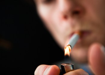 Man lighting a cigarette