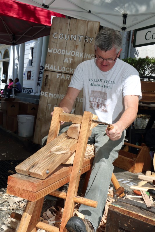 Tom Barry, a representative of Hallockville Farm demonstrates his woodworking skills.