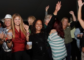 Hands in the air as New Life Crisis sings cover songs from the past and present.