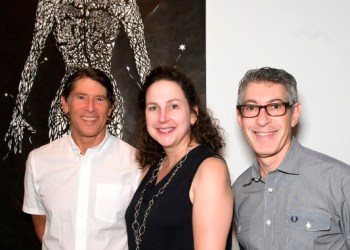 Southampton Art Center board member Paul Travis enjoying the Cut Story exhibit with the center's director, Michele Thompson, and Mark Fichandler.