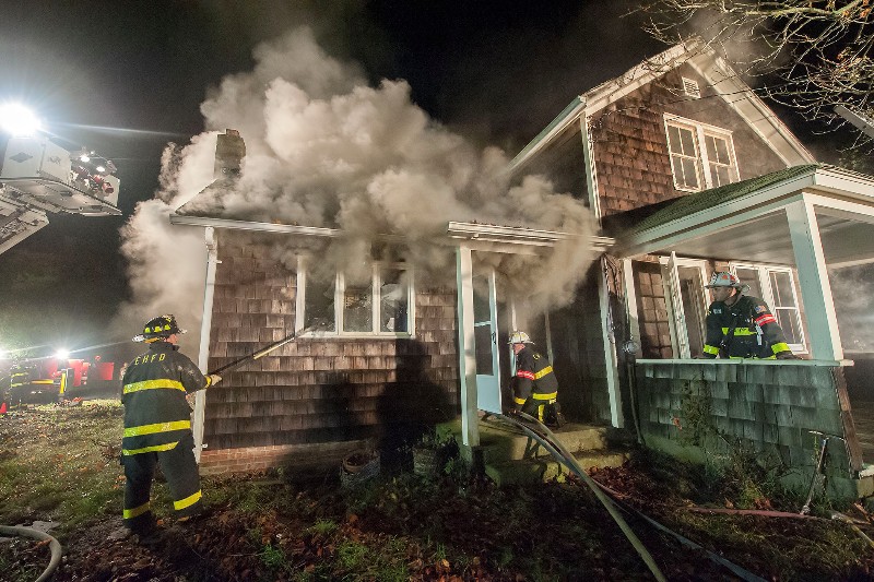 Firefighters participate in a drill at 74 Long Lane using real smoke and fire under carefully-controlled conditions.