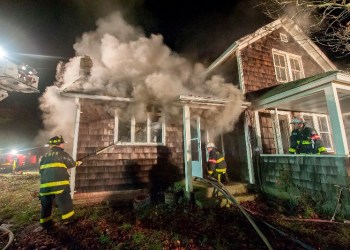 Firefighters participate in a drill at 74 Long Lane using real smoke and fire under carefully-controlled conditions.
