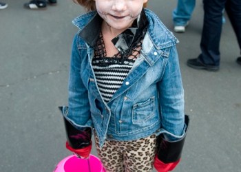 This little ghoul, 5-year-old Coco Lohmiler, had her pink pumpkin ready for treats.