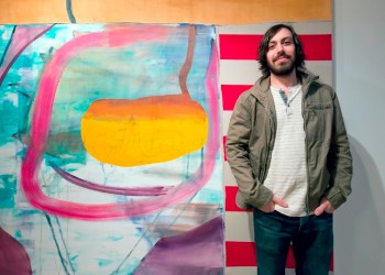  The artist Jonathan Beer with one of the paintings, 