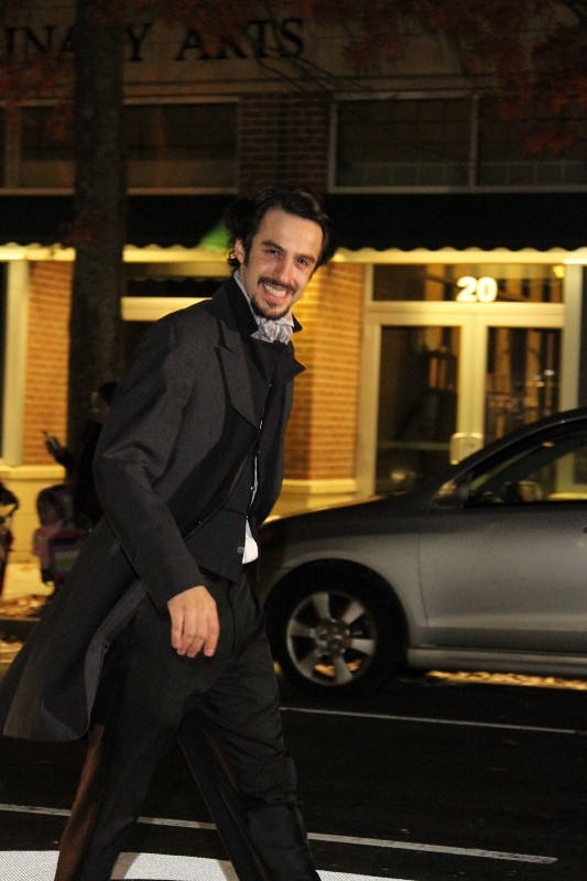 Actor portraying Edgar Allan Poe greets the crowd on Main Street