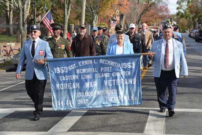 Veterans march down Jobs Lane during the 2014 Southampton Village Veterans Day Parade.