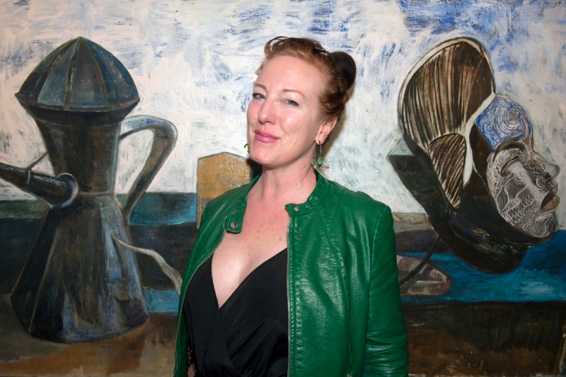 Looking every bit like the star that she is, Kate Mueth in her green leather jacket, brought a little light to the opening of Paton Miller's "Edge Of The World" exhibition of paintings.