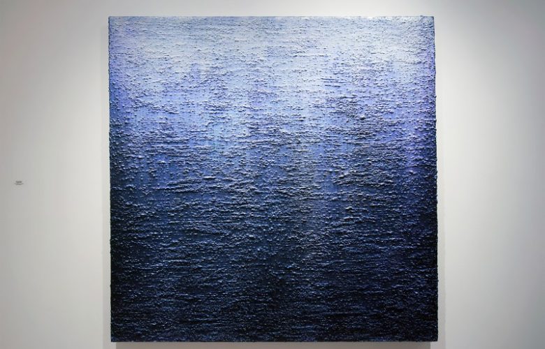 Eric Freeman created this painting with a heavy pebble-like surface and a use of color that seems to change as you move your perspective.