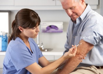 Doctor Giving Male Patient Injection