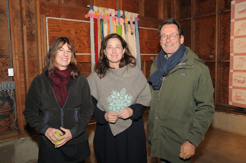 Artist Louise Eastman (center) in front of her work with Barbara Thomas and Geoff Drummond
