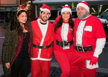 Coming from as far as Hoboken and the North Pole, Lauren Hakim joined her Santa friends Mike Carnevale, Samantha Stone and Nick Romer for a damp Santacon, Riverhead style.