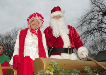  Carol Kroupa in the sled with Santa Claus Dan Rattiner