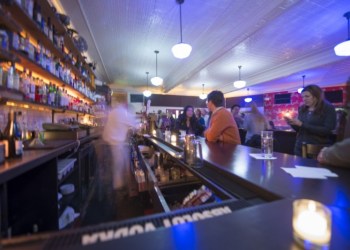 Almond Restaurant turned the lights blue and shimmering to enhance the theme of this month's Artists and Writers Night host, artist Francine Fleischer, who exhibited her photographs, 