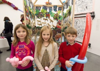 Zoe King with friends Lili and Harben, with their balloon creations in hand, amid the Parrish Art Museum exhibition of Young Artists having the amazing experience of seeing young people's work in a real museum.