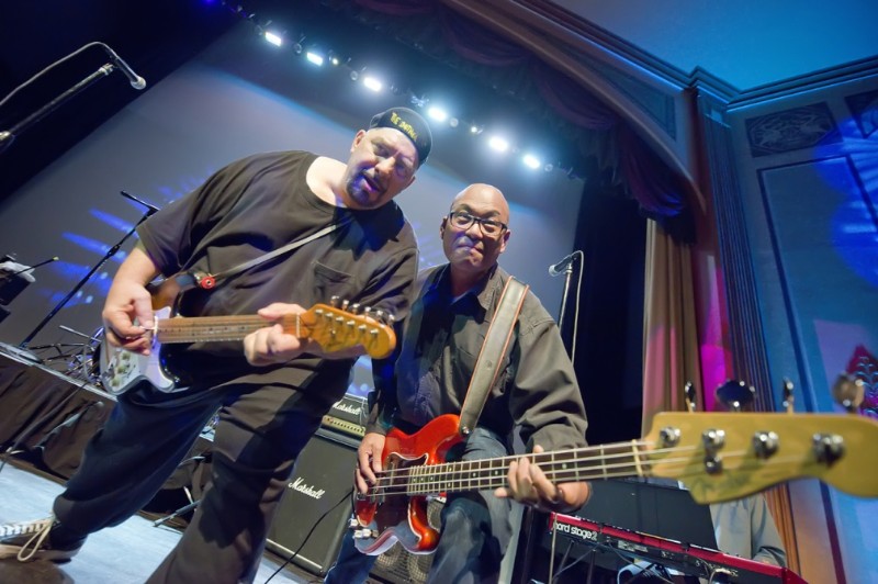 Pat DiNizio leaning in for some hot licks with bassist Severo Jornacion