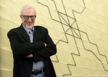Joe Zucker with one of his paintings in the current exhibition
