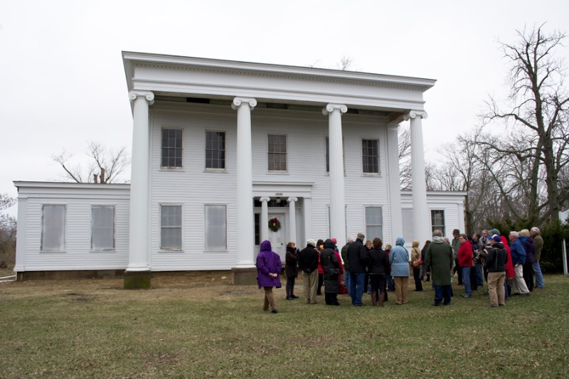 The tour group admires the front of the Nathaniel Rogers House.