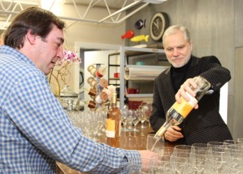 Wolffer Estate Vineyard winemaker Roman Roth pours a glass of wine for Miguel Martin