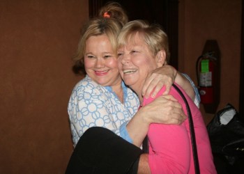 Caroline Rhea poses with a fan.