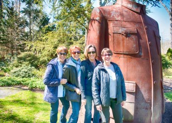 Diane Dalton, Janet Rogove, Kim Voelker and Joan Cartin, made a special sisters day outing to LongHouse Reserve, posing here with the over-sized, cast iron Mao Jacket, a new piece of sculpture by artist Sui Jianguo, at eh LongHouse Reserve.