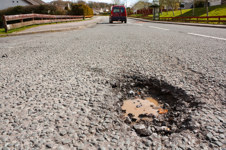 Pot hole in residential road surface
