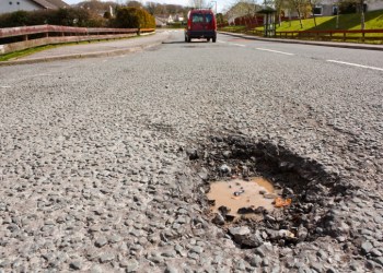 Pot hole in residential road surface