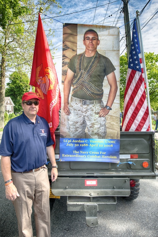 Chris Haerter, father of one of Sag Harbor's fallen sons, with a banner of his son
L Cpl. Jordan Haerter.