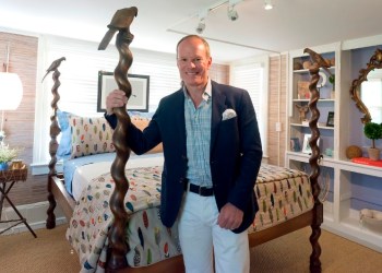 Designer Mark Schryver's showhouse designer room was inspired by Tippy Hedron, a life long animal advocate, featuring cat and bird images like the birds on the bedposts.