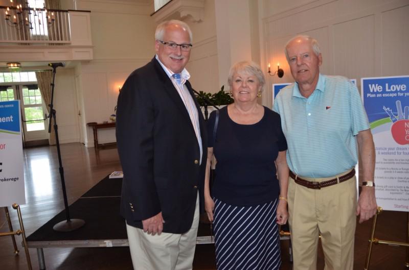 Peconic Bay Medical Center President & CEO Andy Mitchell with honorees Emilie and Michael Corey