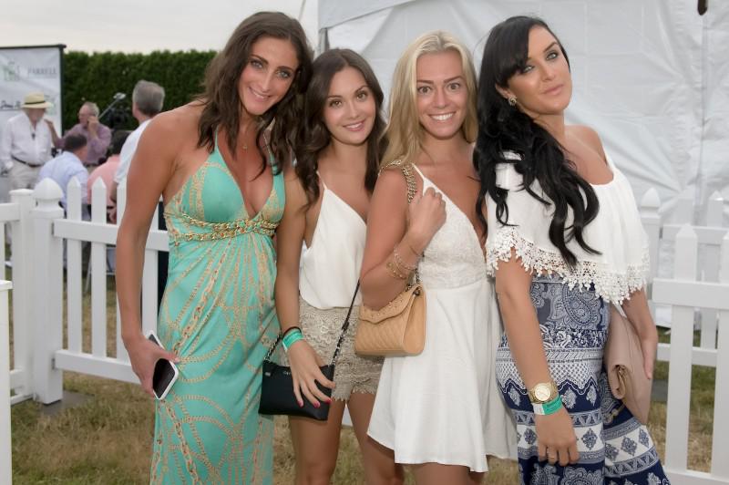 The first four VIP guests entering the big tent full of food and fun.