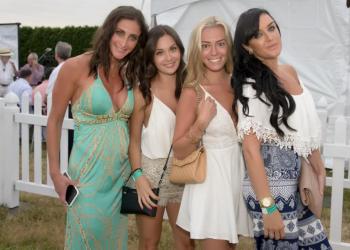 The first four VIP guests entering the big tent full of food and fun.