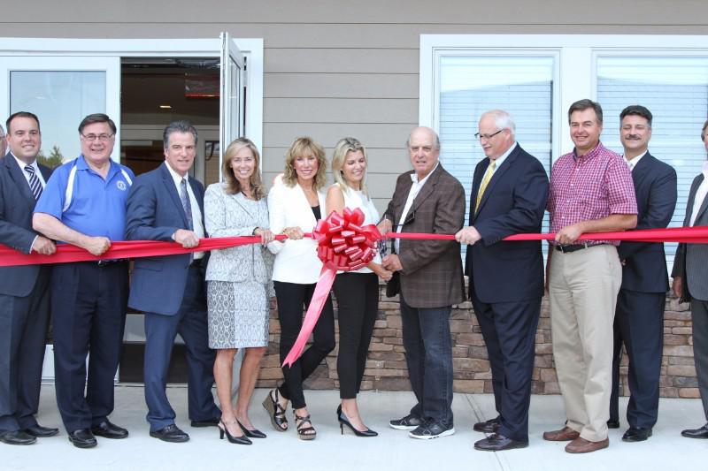 The Grossman family, PBMC personnel, architects who created the facility and local politicians join in as they cut the ribbon for the grand opening of the Grossman Imaging Center