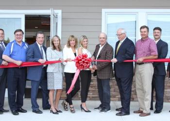 The Grossman family, PBMC personnel, architects who created the facility and local politicians join in as they cut the ribbon for the grand opening of the Grossman Imaging Center