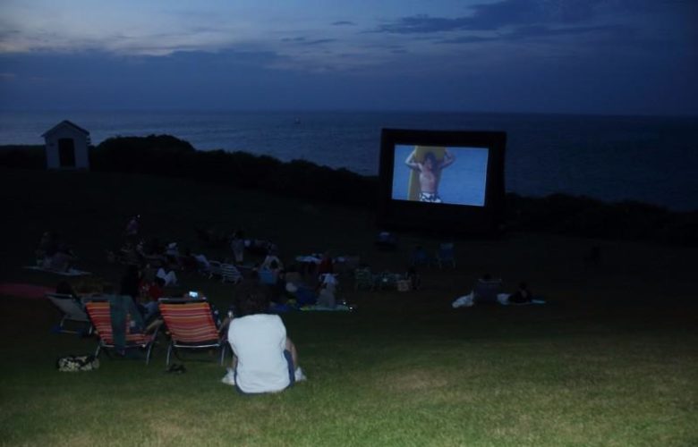 Montauk Surf Museum screens "Endless Summer" outdoors on the grounds of the Montauk Lighthouse