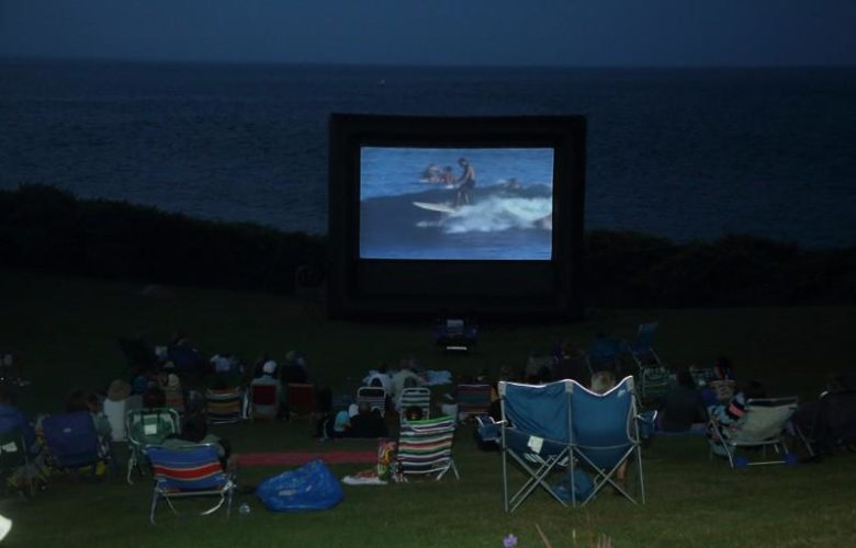 Montauk Surf Museum screens "Endless Summer" outdoors on the grounds of the Montauk Lighthouse