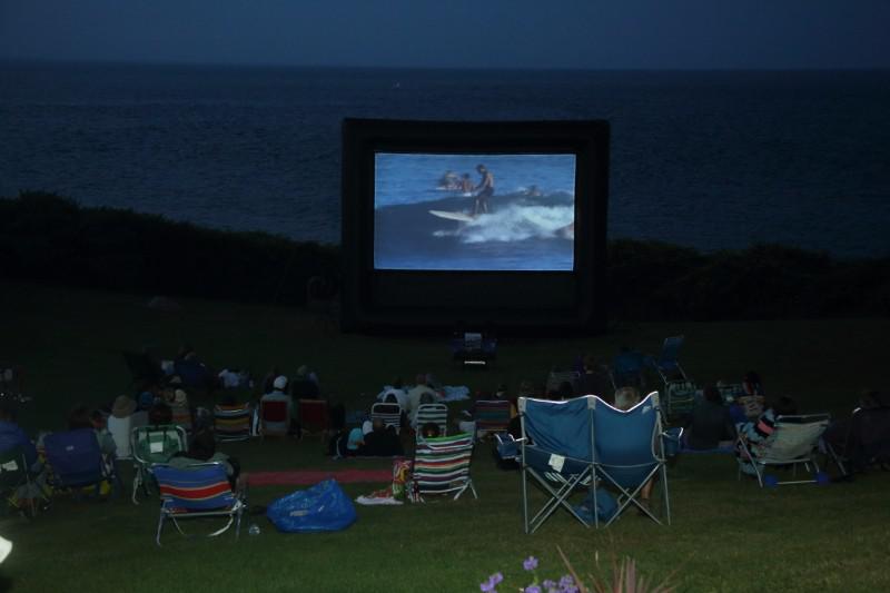 Montauk Surf Museum screens "Endless Summer" outdoors on the grounds of the Montauk Lighthouse